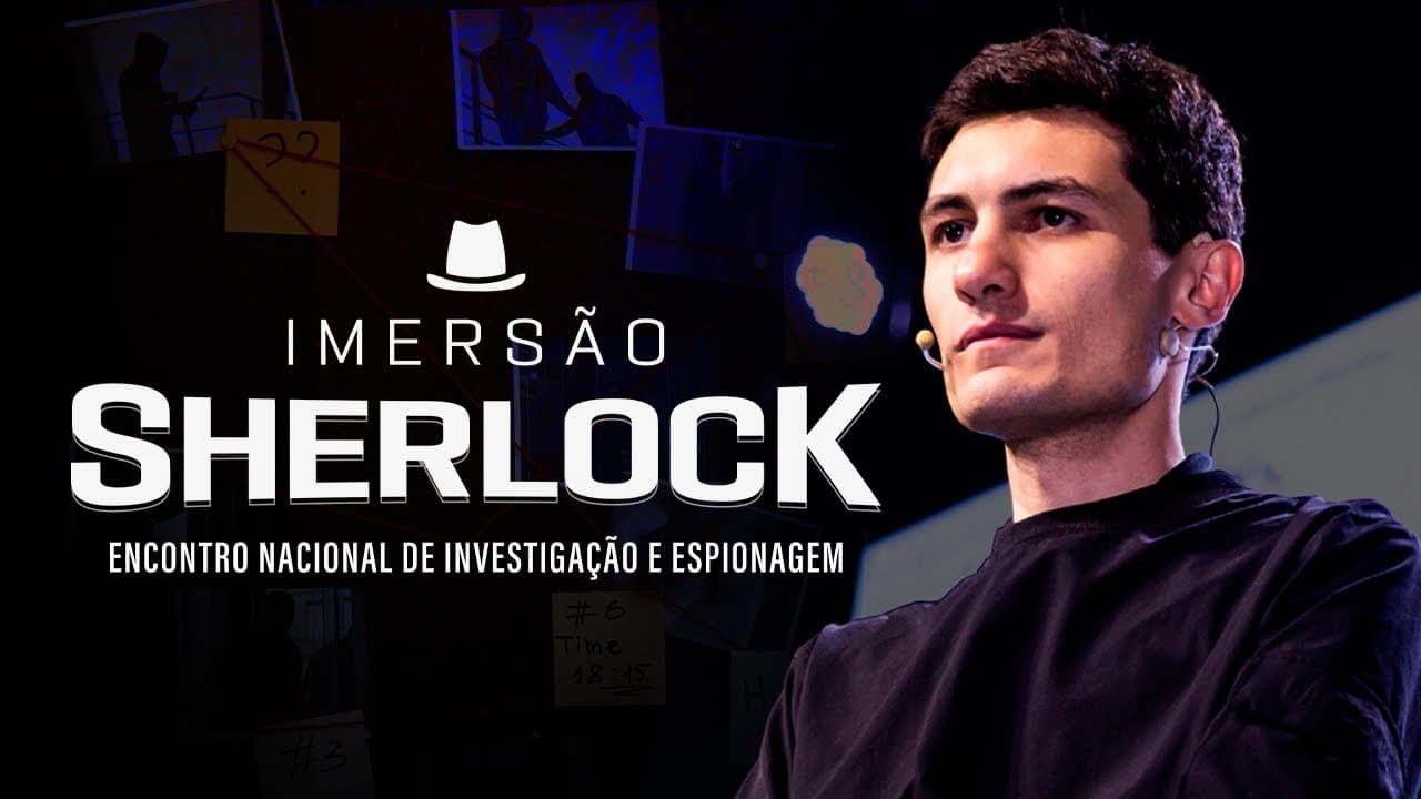 Bruno Fraga em live com equipe apresentando gadgets de hacking incluindo Flipper Zero e dispositivos de espionagem digital sobre uma mesa